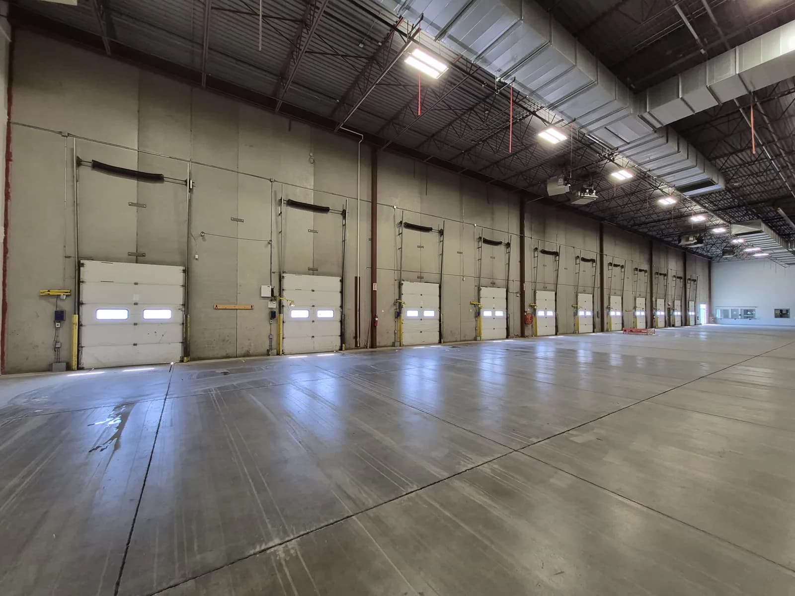 The interior dock wall of the Calgary warehouse with dock doors running down it